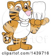 Tiger Cub School Mascot Character Holding A Tooth