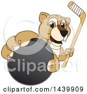 Lion Cub School Mascot Character Grabbing A Hockey Puck And Holding A Stick