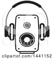 Poster, Art Print Of Black And White Pair Of Headphones And A Speaker