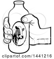 Clipart Of A Black And White Hand Holding A Milk Bottle Royalty Free Vector Illustration