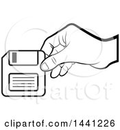 Black And White Hand Holding A Floppy Disk