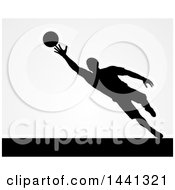 Poster, Art Print Of Black Silhouetted Goal Keeper Soccer Player Blocking The Ball Over Gray