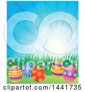 Clipart Of A Group Of Easter Eggs In Grass Against Sunshine Royalty Free Vector Illustration