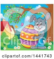 Poster, Art Print Of Happy Gray Easter Bunny Rabbit Holding A Giant Egg By A Tree