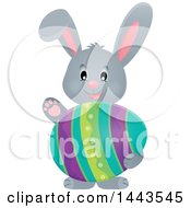 Clipart Of A Gray Easter Bunny Rabbit Holding A Decorated Egg Royalty Free Vector Illustration