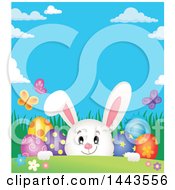 Poster, Art Print Of White Easter Bunny Rabbit Peeking Over A Hill With Butterflies And Decorated Eggs