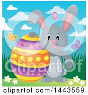 Clipart Of A Gray Easter Bunny Rabbit With A Decorated Egg Royalty Free Vector Illustration