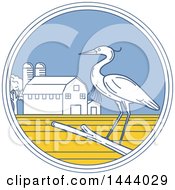 Great Blue Heron Bird On A Branch In A Circle With A Barn And Silo