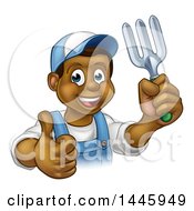 Poster, Art Print Of Cartoon Happy Black Male Gardener In Blue Holding Up A Thumb A Garden Fork