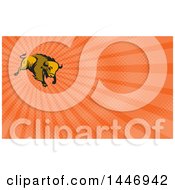 Clipart Of A Retro Charging American Bison Buffalo And Orange Rays Background Or Business Card Design Royalty Free Illustration