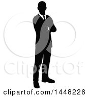 Clipart Of A Black And White Silhouetted Business Man Standing With Folded Arms Royalty Free Vector Illustration by AtStockIllustration