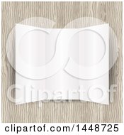 Clipart Of A Blank Tri Fold Leaflet Over Wood Royalty Free Vector Illustration