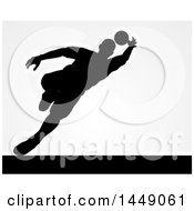 Clipart Graphic Of A Black Silhouetted Goal Keeper Soccer Player Blocking The Ball Over Gray Royalty Free Vector Illustration