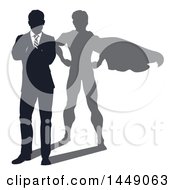 Poster, Art Print Of Silhouetted Business Man Standing With Folded Arms And A Super Hero Shadow