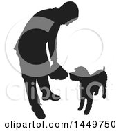 Poster, Art Print Of Black And White Silhouetted Man Feeding His Dog