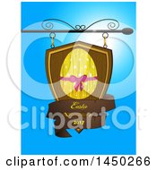 Poster, Art Print Of Wooden Store Shingle Sign With An Easter Egg And Text Banner Against Blue Sky
