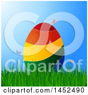 Poster, Art Print Of 3d Colorful Striped Easter Egg In Grass With Butterflies Over Blue