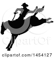 Clipart Graphic Of A Black Silhouetted Horseback Rodeo Cowboy On A Bucking Bronco Royalty Free Vector Illustration by Pushkin