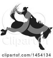 Clipart Graphic Of A Black Silhouetted Horseback Rodeo Cowboy On A Bucking Bronco Royalty Free Vector Illustration