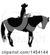 Clipart Graphic Of A Black Silhouetted Horseback Cowboy Royalty Free Vector Illustration by Pushkin