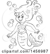 Clipart Of A Cartoon Black And White Mermaid With Bubbles Royalty Free Vector Illustration