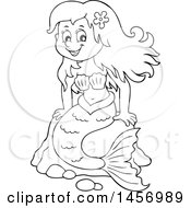 Clipart Of A Cartoon Black And White Mermaid Sitting On A Rock Royalty Free Vector Illustration