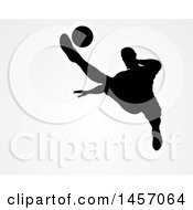 Poster, Art Print Of Black Silhouetted Male Soccer Player Kicking Over Light Gray