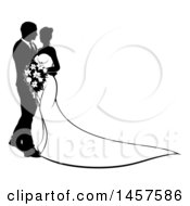 Clipart Of A Black And White Silhouetted Posing Wedding Bride And Groom With A Bouquet Royalty Free Vector Illustration
