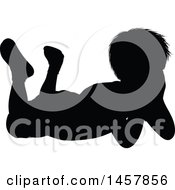 Clipart Of A Black Silhouetted Boy Resting On His Stomach Royalty Free Vector Illustration