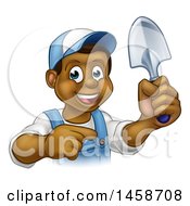 Poster, Art Print Of Cartoon Happy Black Male Gardener In Blue Holding A Garden Trowel And Pointing