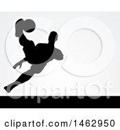 Poster, Art Print Of Black Silhouetted Male Soccer Player Kicking Over Light Gray