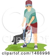 Teenage Guy Training His Dog To Jump Through A Hoop