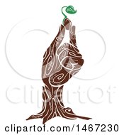 Wooden Hand Holding A Sprouting Plant