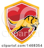 Clipart Of A Leaping Orange Wolf Over A Shield Royalty Free Vector Illustration