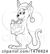 Clipart Of A Christmas Kangaroo Holding A Gift Black And White Royalty Free Vector Illustration by visekart