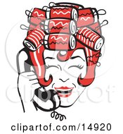 Red Haired Housewife With Her Hair Up In Curlers Laughing While Talking On A Landline Telephone