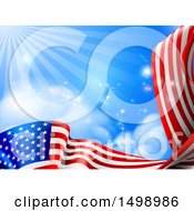 Clipart Of A Rippling American Flag Under Blue Sky With Rays Of Sunshine Royalty Free Vector Illustration by AtStockIllustration