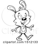 Clipart Of A Black And White Happy Walking Female Rabbit Royalty Free Vector Illustration