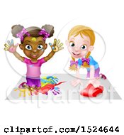 Black Girl Finger Painting And White Girl Playing With A Toy Car