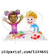 Black Girl Finger Painting And White Boy Playing With A Toy Car