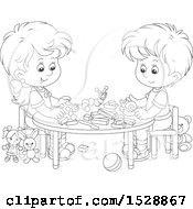Black And White Boy And Girl With Blocks And Toys At A Table