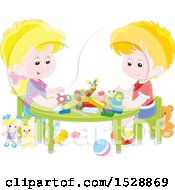 White Boy And Girl With Blocks And Toys At A Table