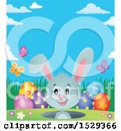 Clipart Of A Gray Bunny Rabbit With Easter Eggs Royalty Free Vector Illustration