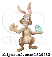 Clipart Of A Brown Easter Bunny Rabbit Holding An Egg Royalty Free Vector Illustration