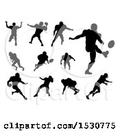Clipart Of Silhouetted Football Players Royalty Free Vector Illustration