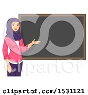 Female Muslim Teacher Presenting A Blackboard