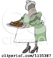 Black Woman Holding A Sheet Of Brownies