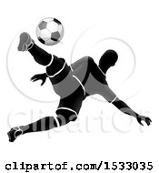 Poster, Art Print Of Silhouetted Male Soccer Player Jumping And Kicking
