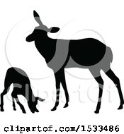 Clipart Of A Black Silhouetted Deer Doe And Fawn Royalty Free Vector Illustration