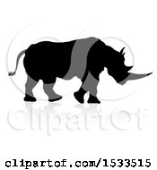 Clipart Of A Silhouetted Rhino Walking With A Reflection Or Shadow Royalty Free Vector Illustration